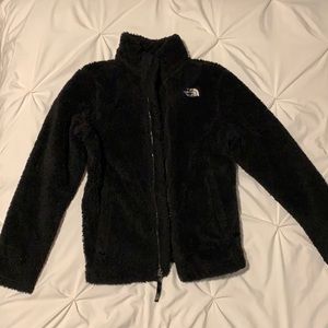 Black fuzzy North Face zip-up.